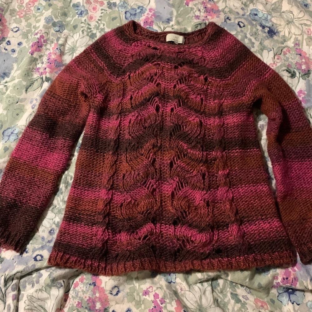 Women’s sweater with cut out details and fall warm colors